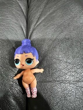 Purple-Haired Doll with Big Blue Eyes